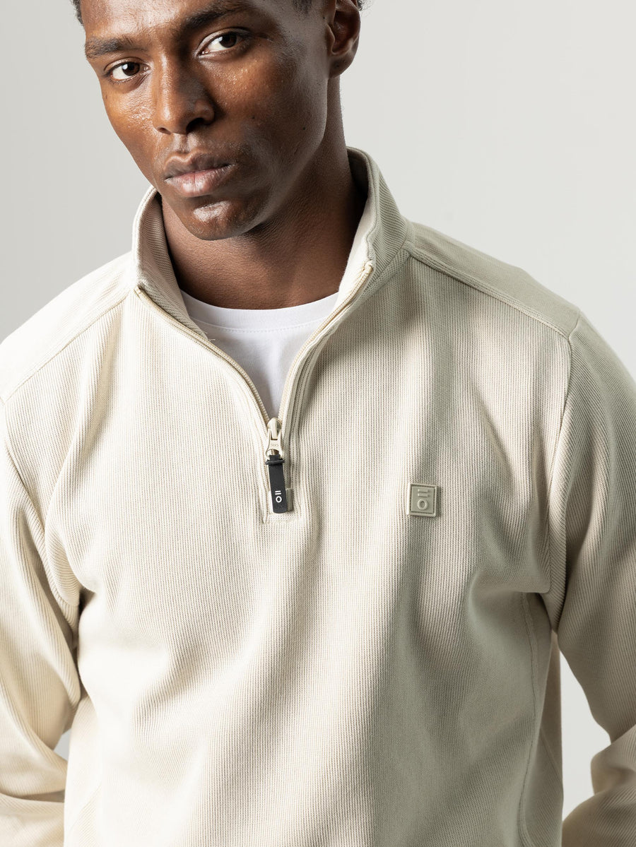 SUDADERA CUELLO MOCK MEDIA CREMALLERA CRUDO